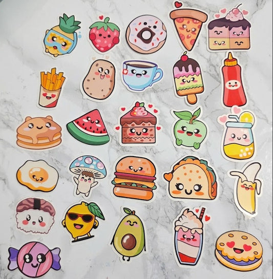 Collection of colorful food-themed stickers on a marble surface